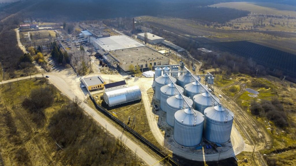Aerial view of an industrial plant with steel storage tanks